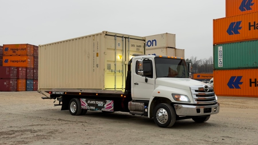 Shipping container transported on a flatbed truck