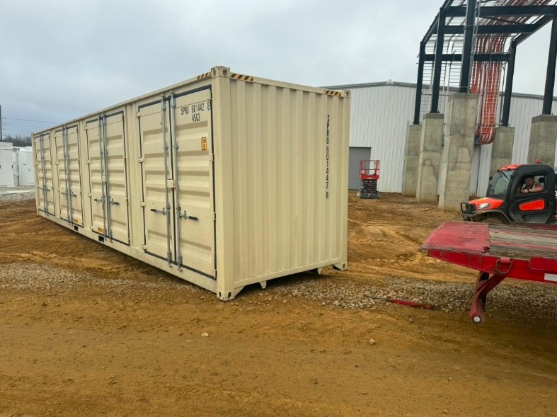 Light-colored shipping container with multiple cargo doors